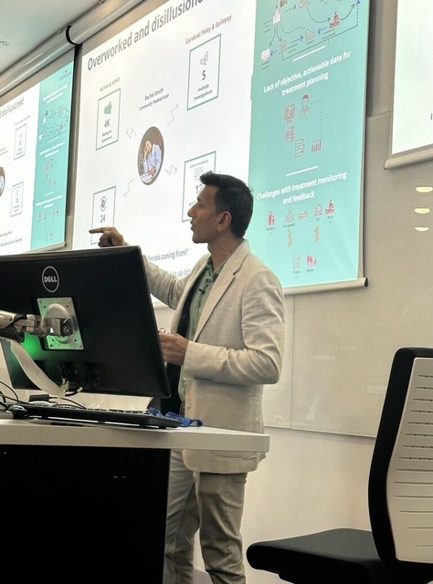 Saran Muthiah, Founder and CEO of EnrichMyCare, presenting clinical pathway data to a professional audience